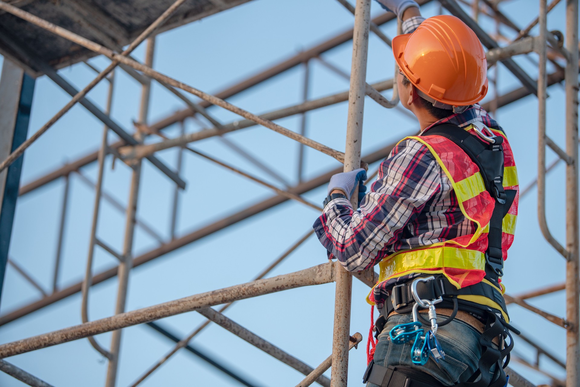 Worker on the  scaffolding construction site